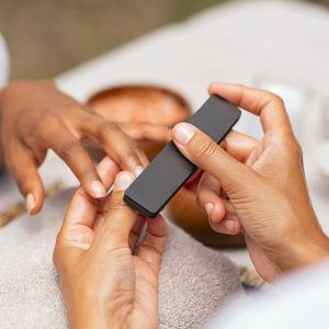 woman-using-a-buffer-to-file-nail